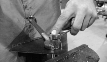 Be sure to hold the rivet nut flush to the surface and square to the hole as it is tightened. (Fig.