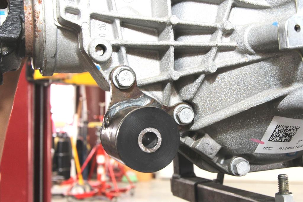 As shown in Figure 11, remove the 2 differential case bolts and use them to bolt the 8386 bracket onto the differential and torque now to 30 ft-lbs.