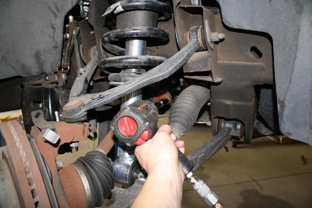 Skip to Step 4 for 2WD. Remove the tin cap from the spindle to expose the axle nut, remove axle nut with 36mm socket.