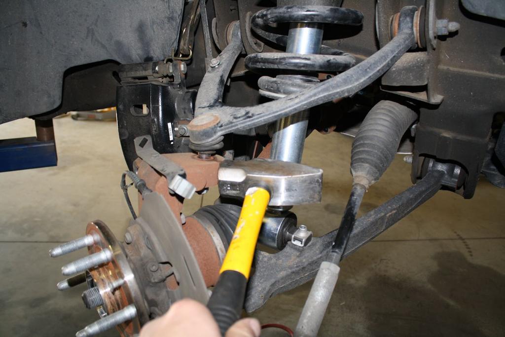 Figure 4: break loose upper ball joint, and lower ball joint Figure 5: shock and spindle removed 8) If you purchased, or your kit includes the Cognito upper control arm kit, remove the factory upper