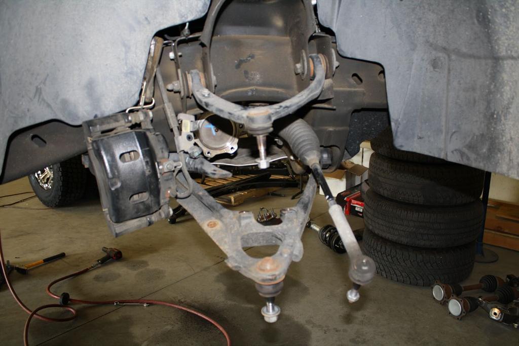 Remove front differential skid plate and discard, if so equipped. Unplug the differential s electronic coupler(s) and breather hose. Unbolt the front drive shaft from the differential yolk.