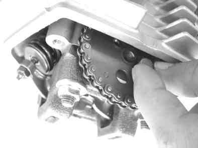 the cam chain is found stretched properly and you can move the flywheel without difficulty, and