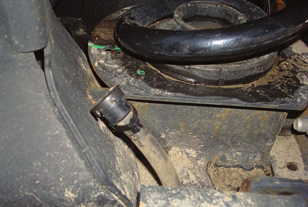 On the driver s (left) side by the axle on some models, there is a small vent tube (Fig. 4) that needs to be tied on an angle with a zip tie (BB).