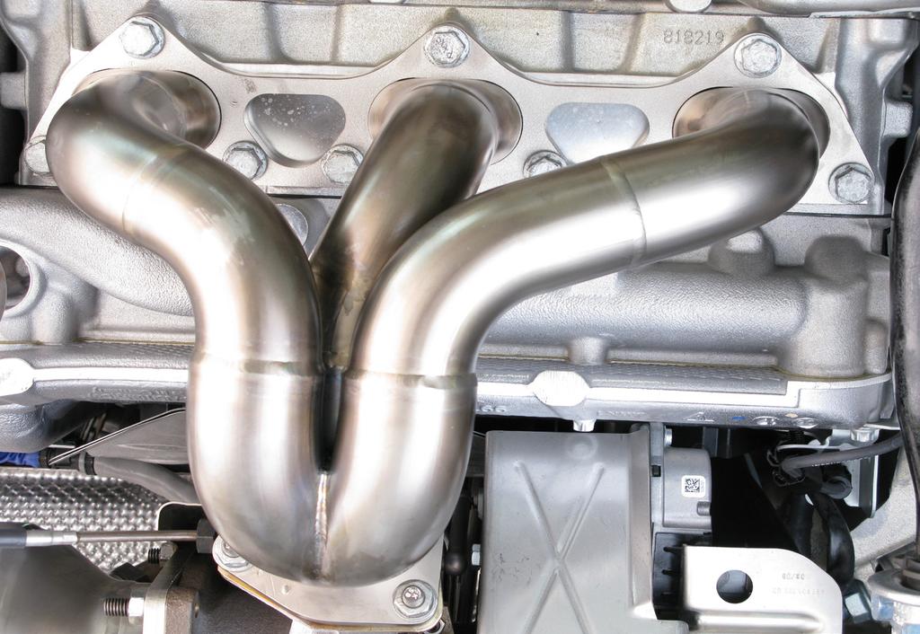 INSTALLATION OF THE AKRAPOVIČ EXHAUST SYSTEMS: 1. For Evolution: set the left and right Akrapovič headers with new stock gaskets and hand tighten all bolts and nuts first (Figure 13, 14.