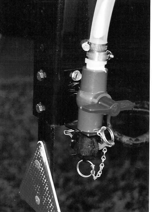 Drill 1/4 (7mm) holes to accept the valve holder bracket and use 5/16 x 1 self-tapping screws. 5. Connect valve assembly to other end of hose.