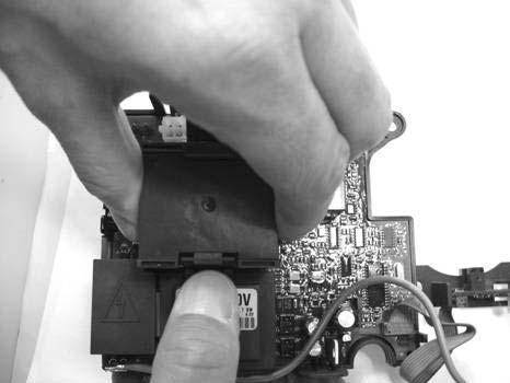 Using your other hand, remove contactor (B) by pulling
