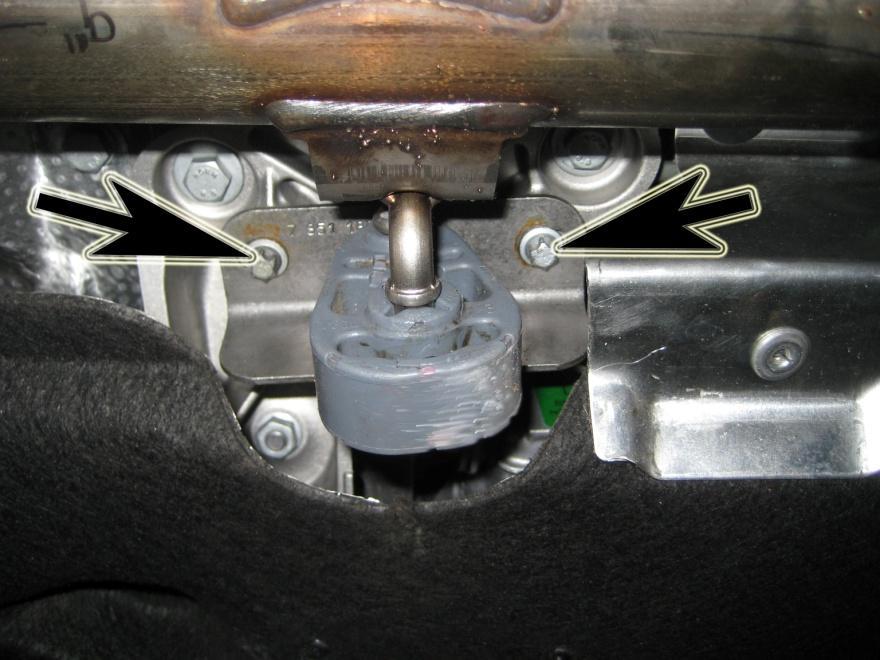 5. Unbolt exhaust hangers next to the transmission by removing the two Torx