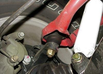 Separate knuckle from upper ball joint with removing tool HT72520000. See illustration #5. Illustration #7 Illustration #5 6. Remove the upper control arm adjusting bolts. See illustration #6.