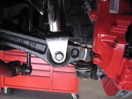 the Eibach Multi-Pro Coilover into the vehicle and secure the upper mount to the strut tower