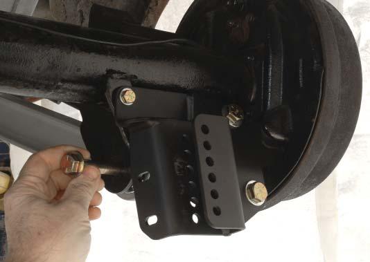 25. Remove the rear lower control arm bolts at the rear end housing bracket.