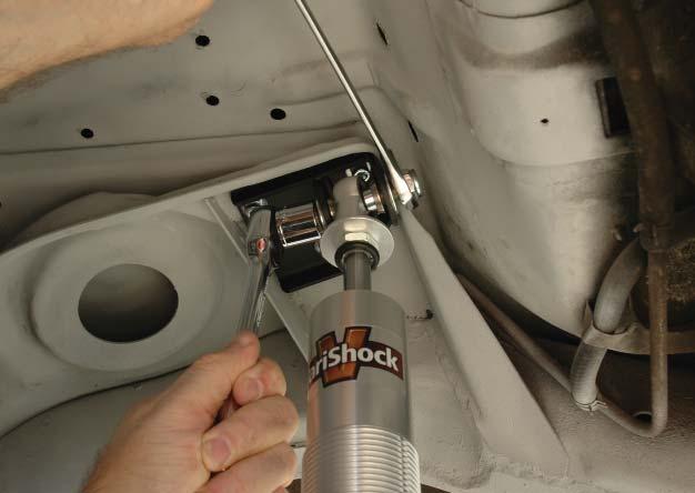 37. Install the coil-over shock between the upper and lower