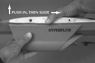 3. Holding the fuselage in one hand and the Power Pod in the other, slide the Power Pod into the forward part of the slots in the fuselage. Make sure that all of the tabs are inserted.