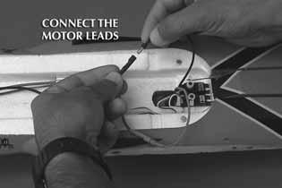 Connect the black motor wire to the black ESC wire. Position these wires in the fuselage so that they do not interfere with the two servos. 5. Locate the left and right Power Pod locks.