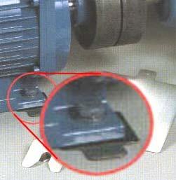 Moving the position of the motor by placing a shim (thin piece of metal) under the feet is