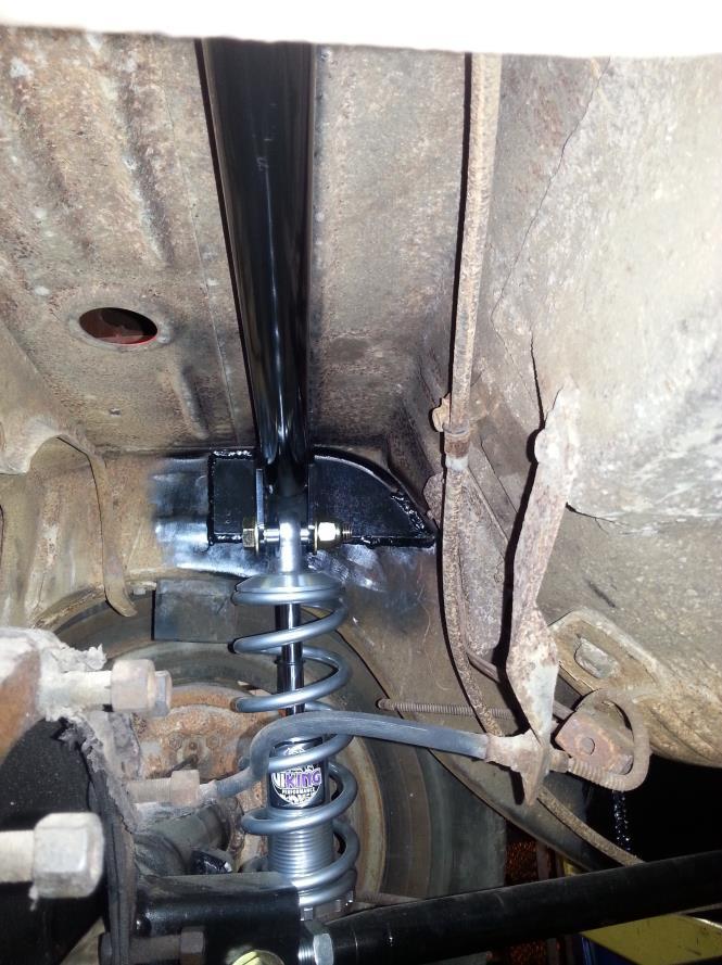 9. Attach the lower coil over mount studs into the holes on the lower trailing arm brackets on the differential tubes. The lower you locate the stud, the lower the car will sit.