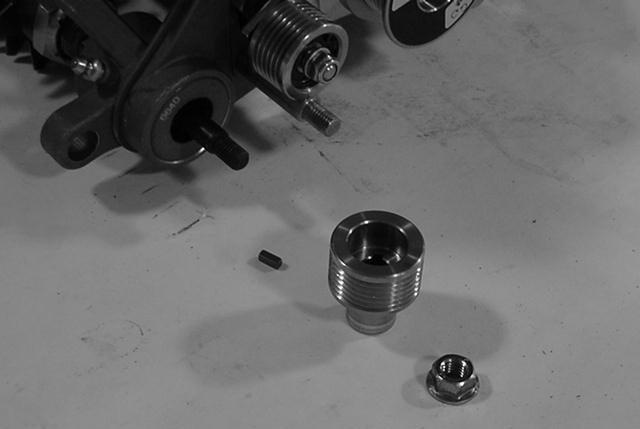 Secure motor mount and side plate to right end of cutting unit with () socket head screws and nuts previously removed (Fig. 9).