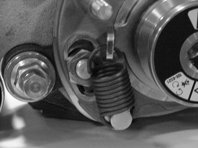 Insert belt onto driver pulley, idler pulley and driven pulley routing as shown in figure 8. Make sure belt is riding correctly in the grooves.. Roller shaft bolt Figure. Drive belt Figure 8 9.