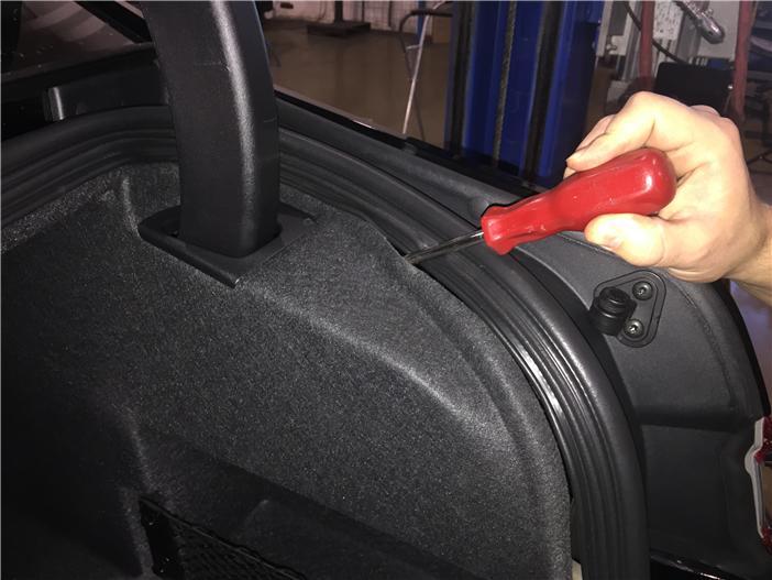 Use pry bar to remove trunk liner guard, set