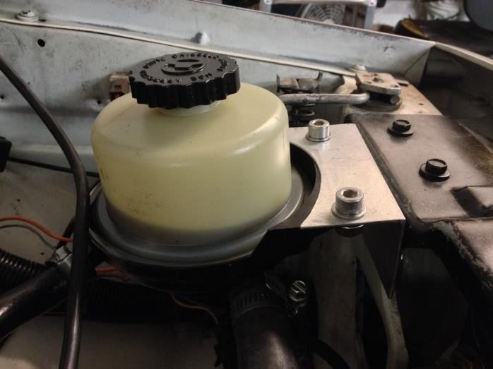 Ensure reservoir is placed above power steering pump to prevent air getting in system 26.