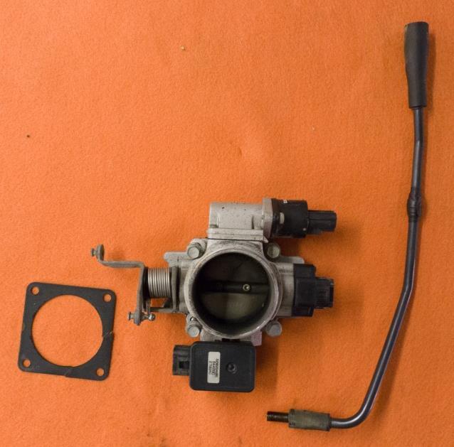 8. Remove throttle body. 8.1. Disconnect three wire connections on throttle body before removing show in Figure 14 8.1.1. Idle air control connector (IAC) 8.