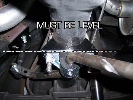 Lift the sway bar into position, and attach to u-bolts with the
