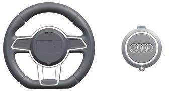 Attach the Steering Wheel 11 1. With a screwdriver remove the screw on the battery cover located in the center of the steering wheel. 2.
