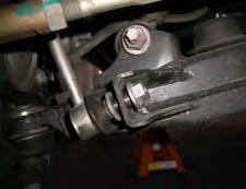 Remove the 12mm brake line retaining bolt from the bracket connected to