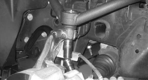 19. Working on the driver side, install the newly installed upper control arm to the knuckle and