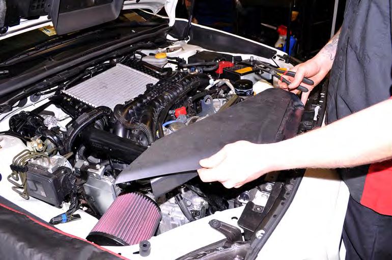 Some may find it easier to access things by removing the passenger side radiator fan.