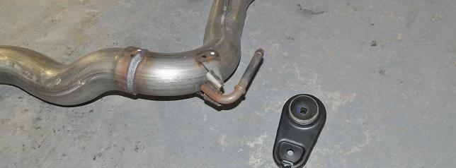 The driver muffler assembly will not be free from the vehicle.