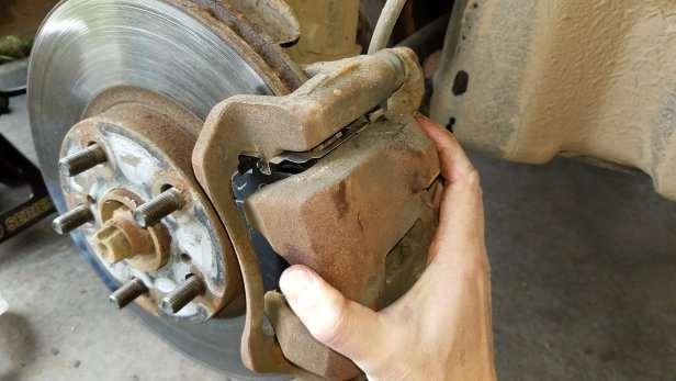 Then go ahead and slide the caliper back on to the brake