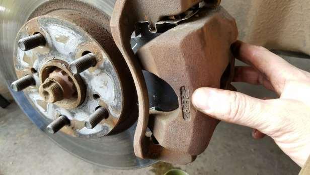 Once you tighten to the caliper bolts. Go ahead and move the caliper back and forth.