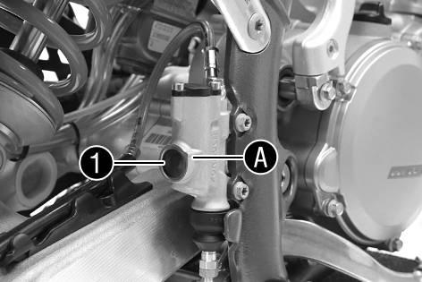 Adjust the free travel on foot brake lever according to specifications. Disconnect spring. Loosen nut and, with push rod, turn it back until you have maximum free travel.