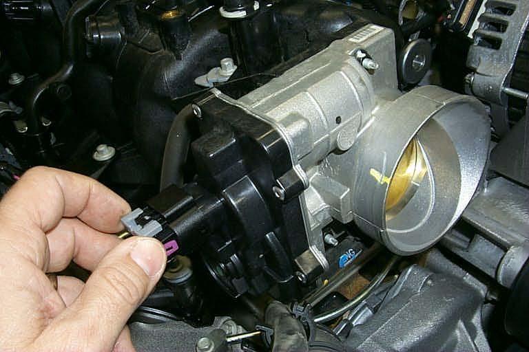 Disconnect Electrical Throttle Control (ETC) connector from the throttle body by removing the gray