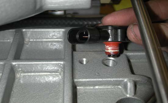 Remove the stock MAP sensor from the stock intake manifold by pulling back on the two tabs and
