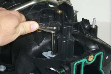Next, using a #5 internal Torx socket remove the three mounting studs from the stock intake manifold. 90.