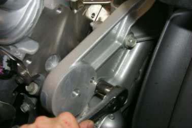 96. In the original tensioner location, install the new tensioner support