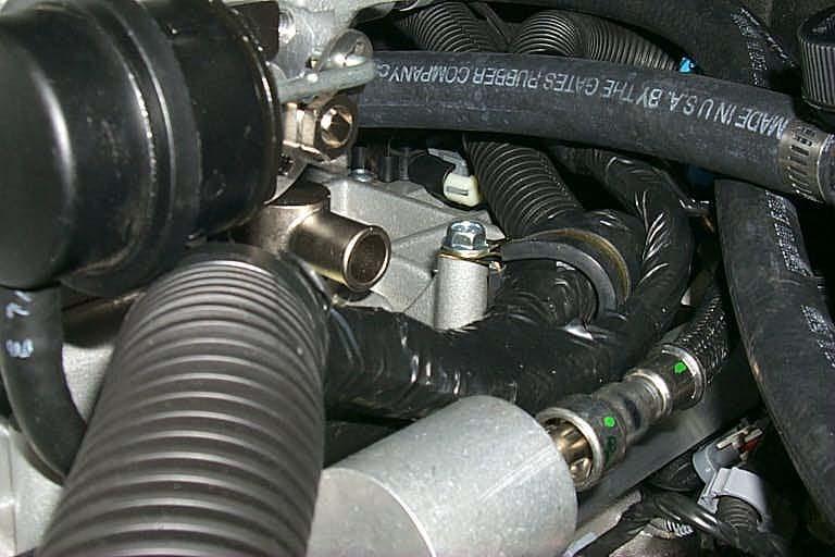 and attach it to the supercharger manifold as shown, using