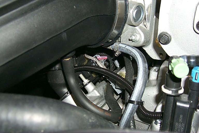 124. Attach the PCV hose from the right (passenger) side valve cover to the brass barb on the