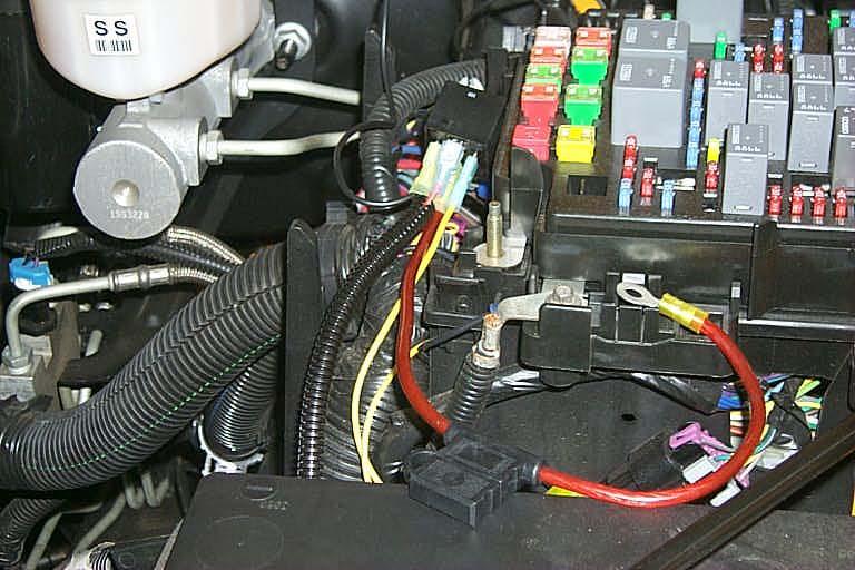 Cover the red and black wires that lead to the intercooler coolant pump connector with the split loom supplied.