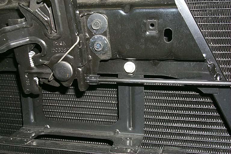 160. Remove the transmission cooler bolt located below and to the right of the