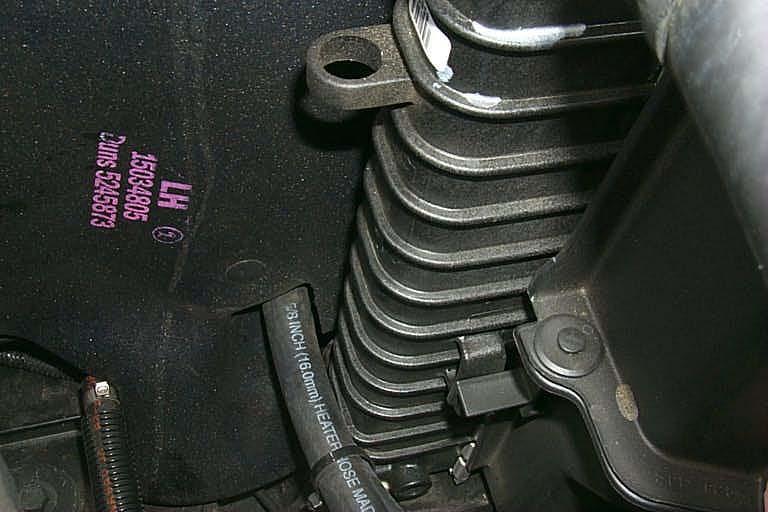 164. In the rubber weather shield beside the radiator, make a slot or hole for the hoses from the intercooler