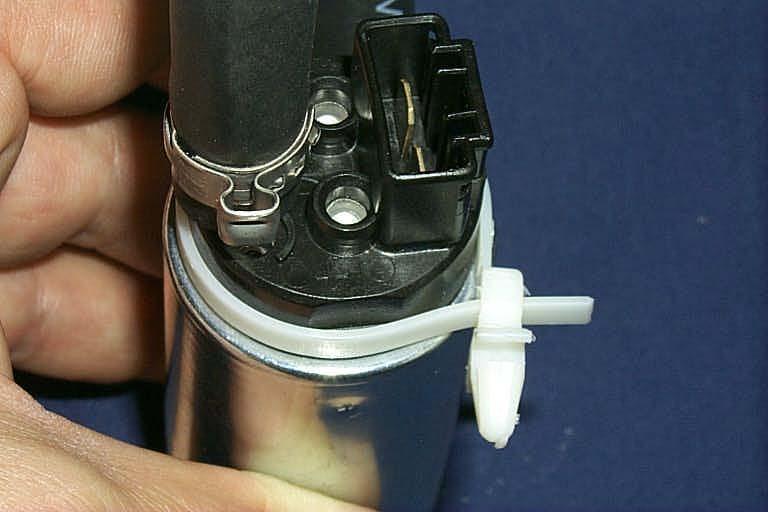 Secure the clamp by using a pair of side cutting pliers to crimp the loop of the