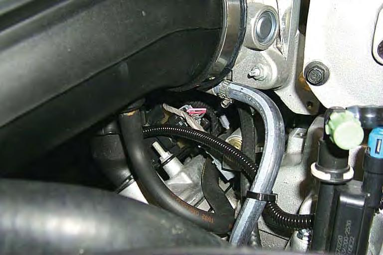Connect the PCV hose from step 74 to the remaining barb next to the power brake hose connection on the back of the inlet