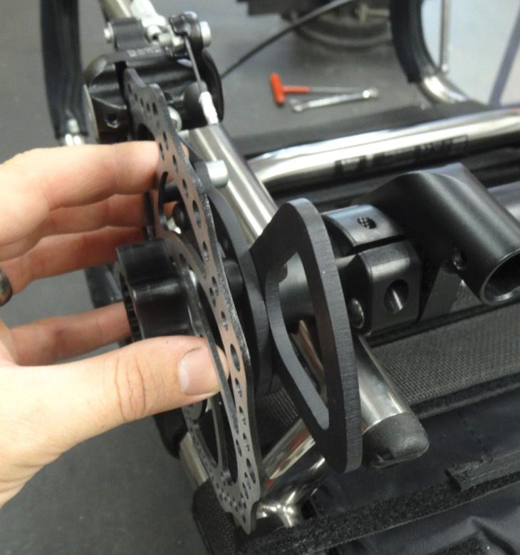 Step 6: Using wheels with spline drives installed, position each disc brake assembly according to the specifications noted