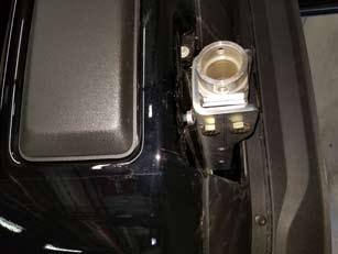 Remove the front bolts from each of the tow hooks.