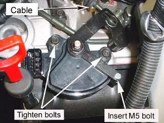 Tighten the two 10 mm mounting bolts to specification. Remove the 5mm drill or M5 bolt. Specification: 7-8 lb ft.