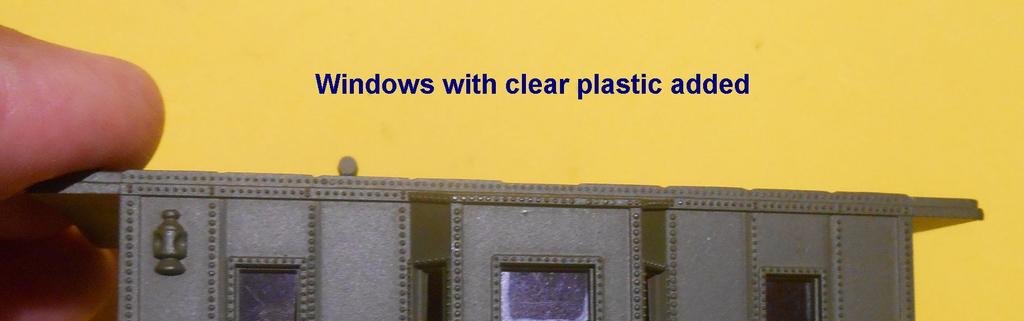 Cut out a patch to a size larger than the window and glue in on the edges with liquid plastic glue. You can also use 2 pieces of clear adhesive tape stuck onto one another.