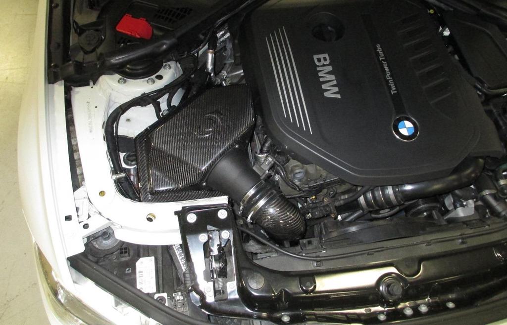 16. Remove the rag from the turbocharger inlet, and install the Dinan intake into the vehicle.