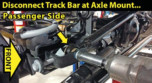 Raise the front of vehicle with a jack and secure a jack stand beneath each frame rail.